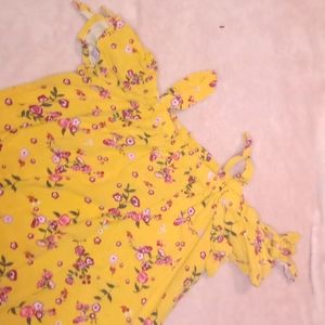 I am selling a nice of the shoulder yellow top with a pretty flower pattern